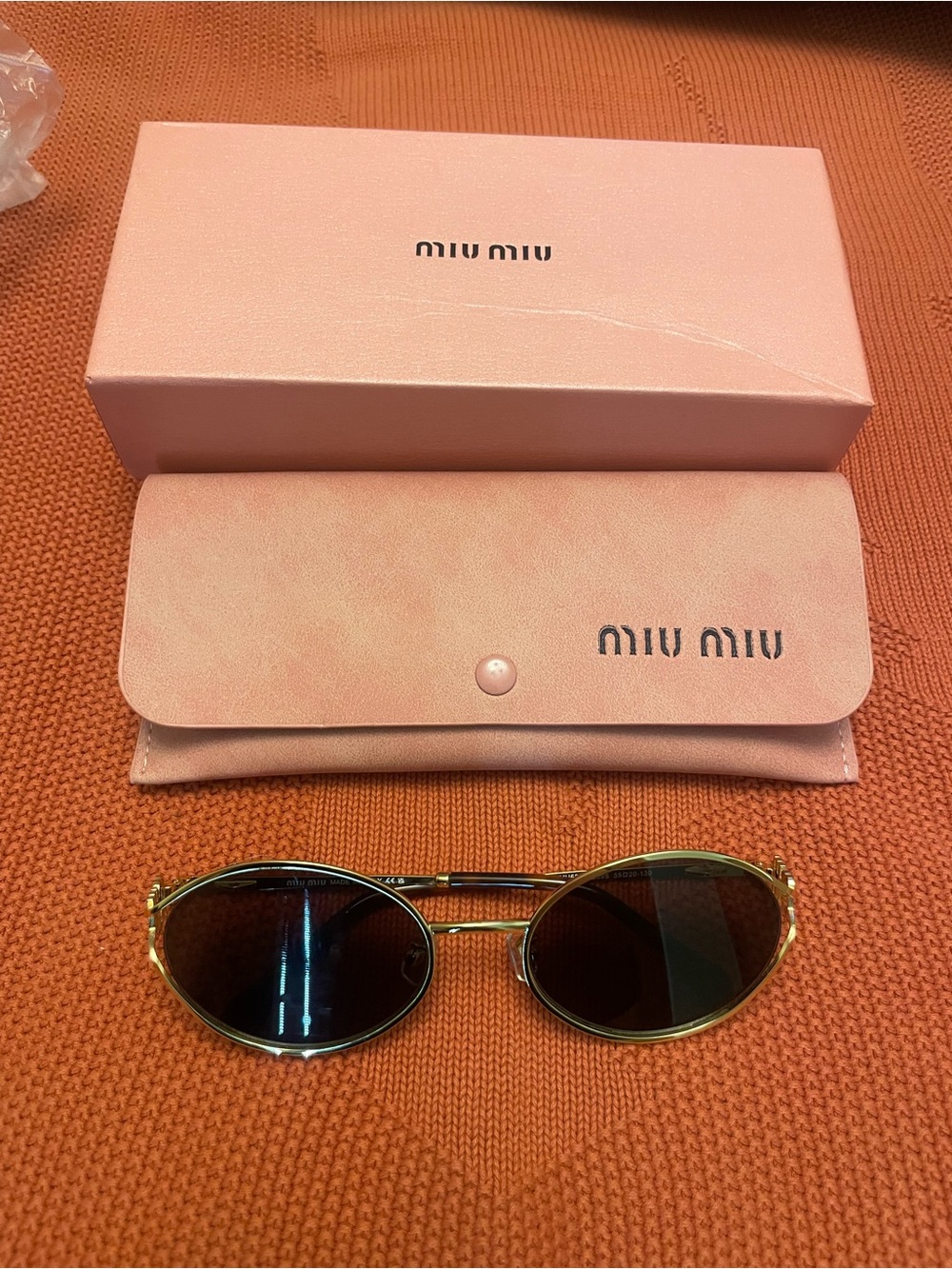 Miu Miu Gold Frame Sunglasses with Pink Case